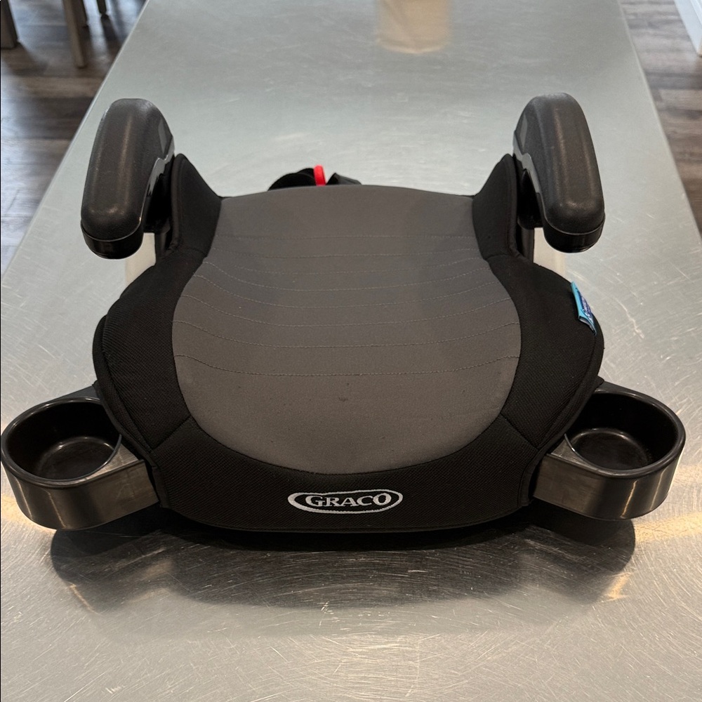 Graco Black Booster Seat with Cup Holders
With seat protector